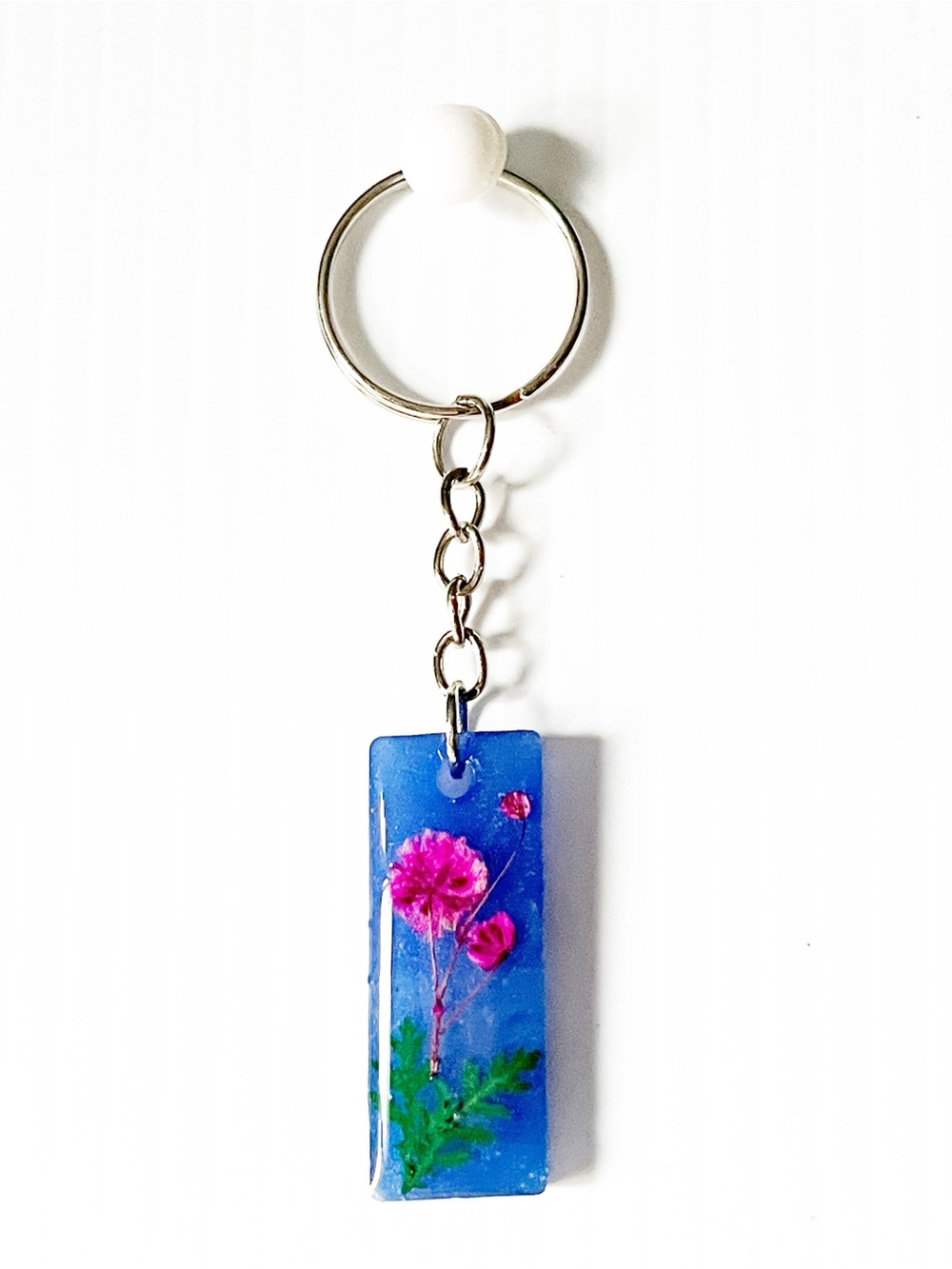Blue Resin Keychain with Pink Flower NWOT